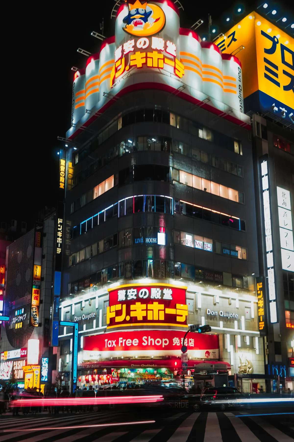 Don Quijote store lit up at night with Tax Free Shop sign
