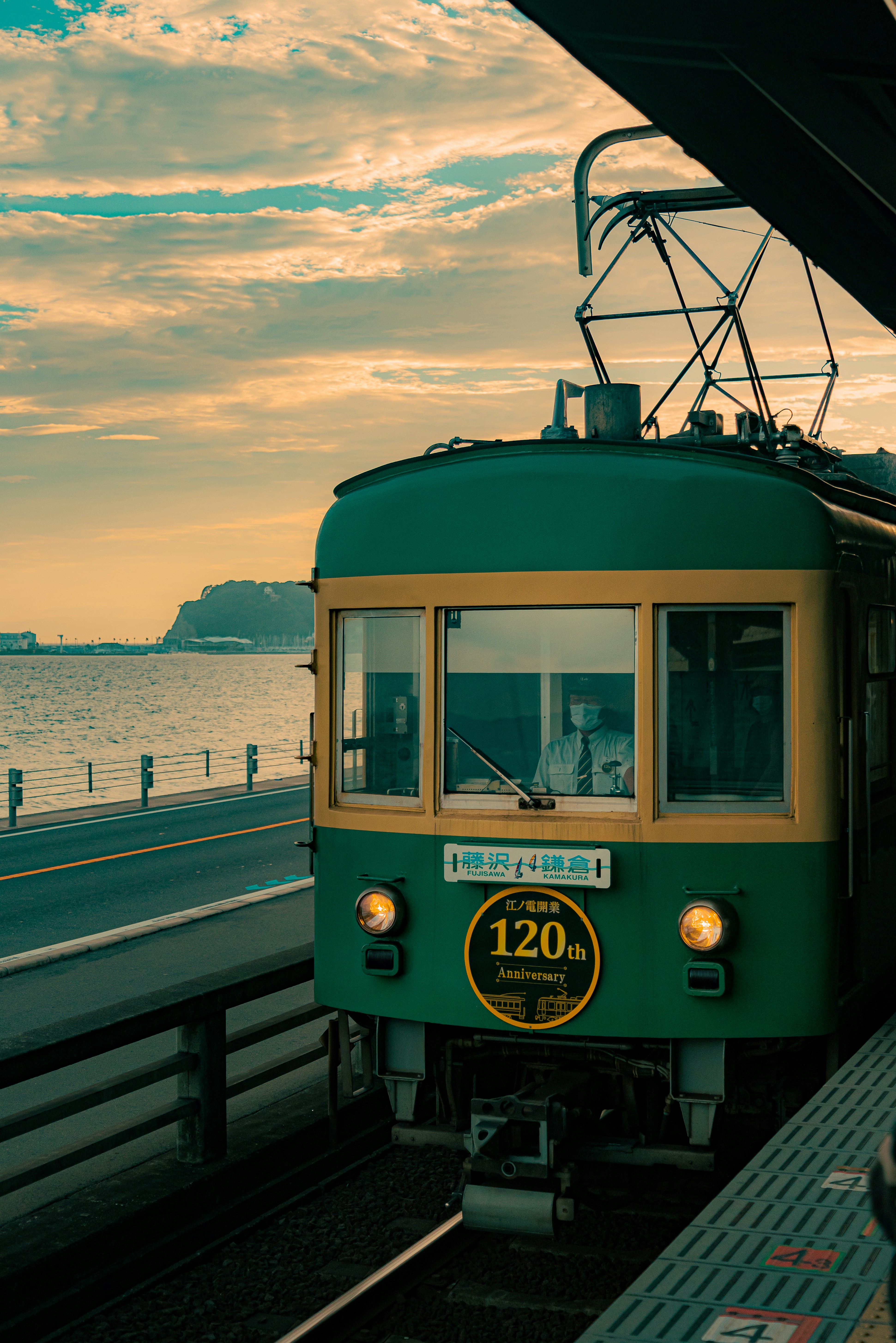 Enoden train along the Kamakura coastline at sunset